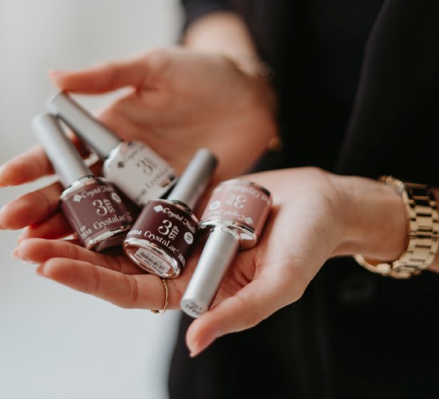 Woman applying skincare product on her face